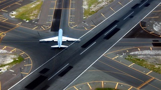 Airport runway with plane