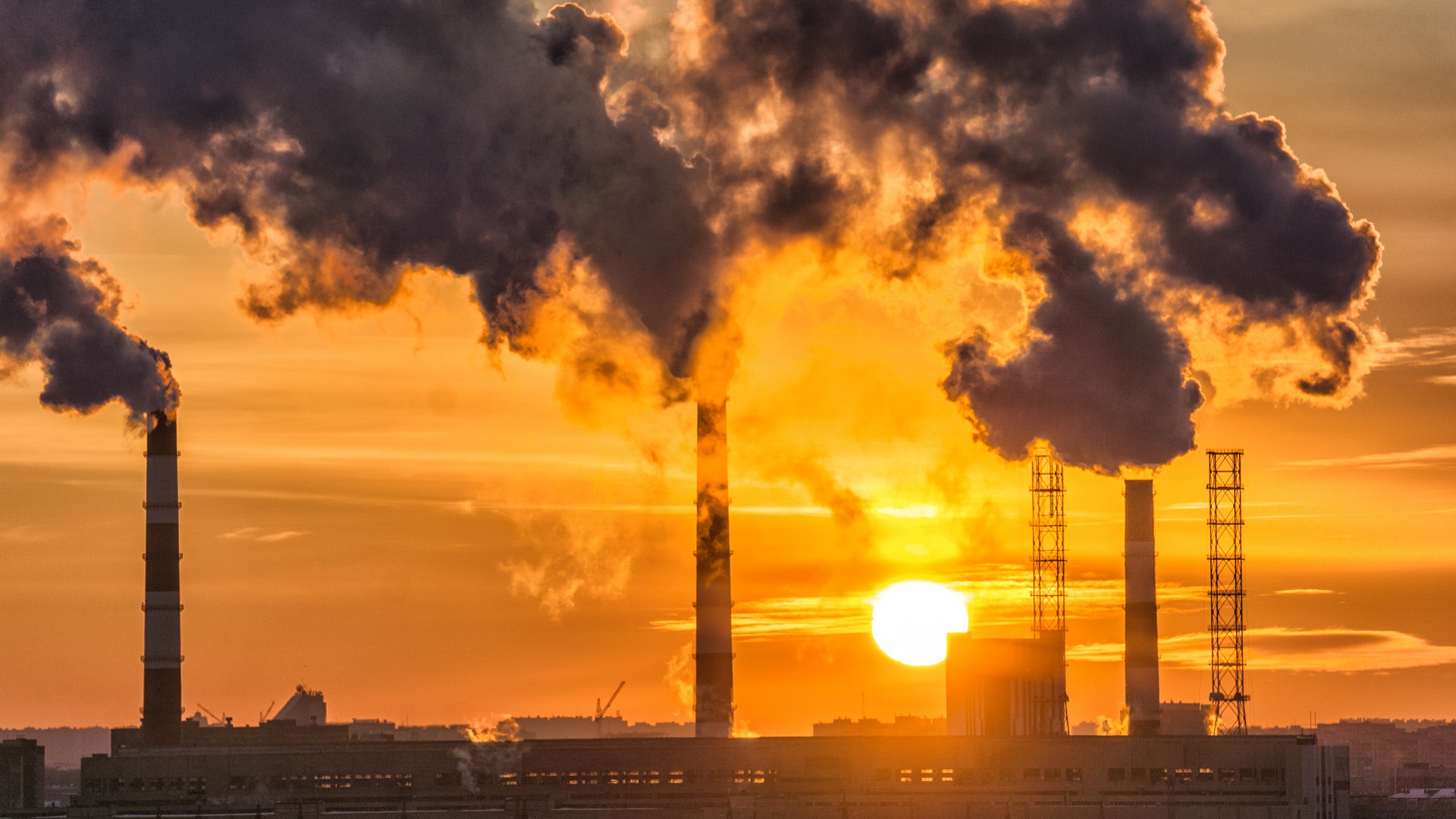 industrial smoke at sunset