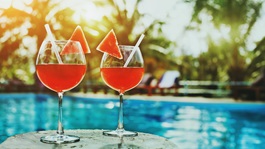 Two drinks by a resort pool