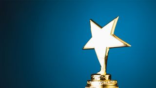 An award with a gold star on a blue background