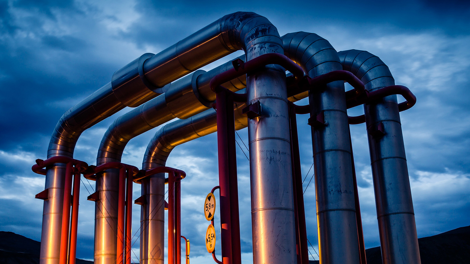 Geothermal energy pipeline at night