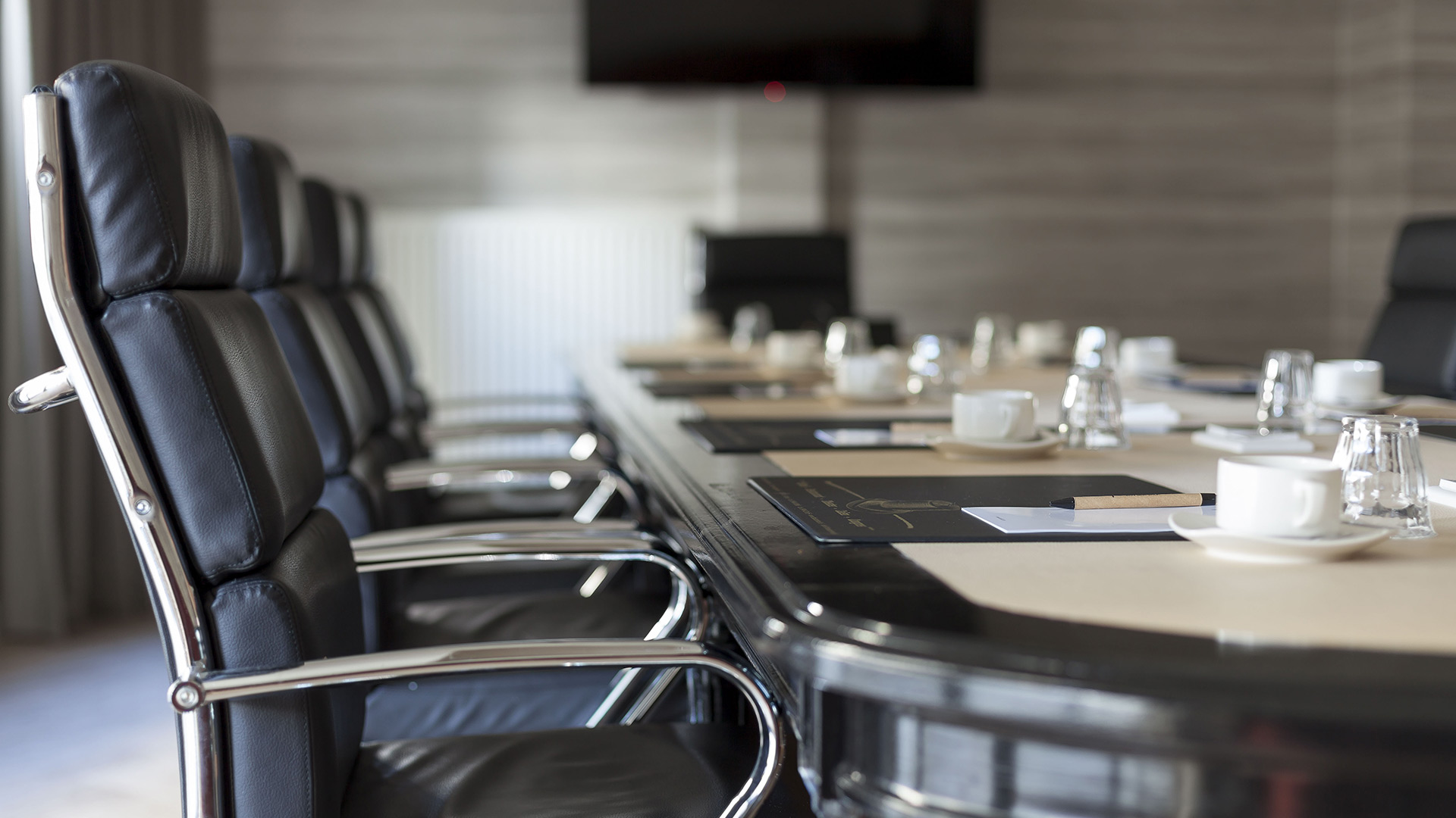 Boardroom table set for a meeting