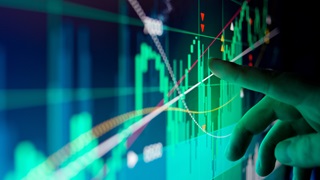 Finger pointing to bar graph on screen