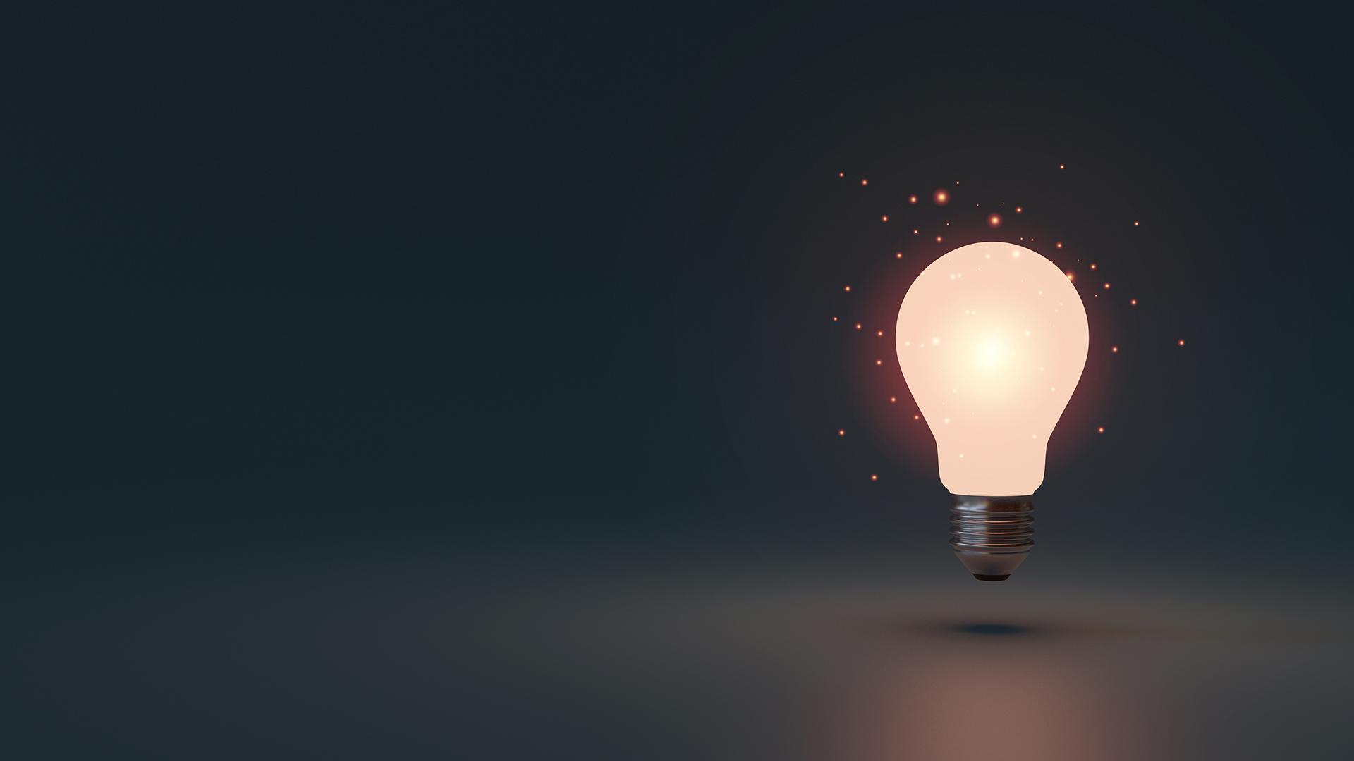 Lightbulb glowing in dark area with copy space for creative thinking and solving solution concept by 3d rendering technique.