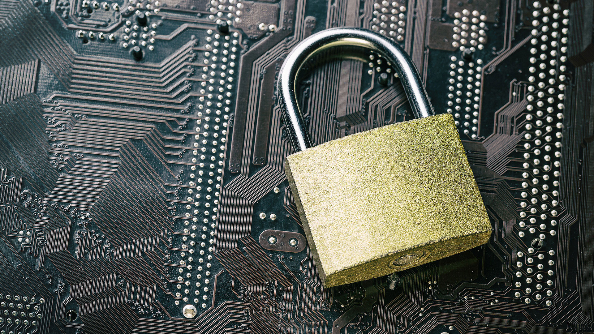 Padlock sitting on circuit board