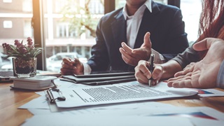 two people working at desk