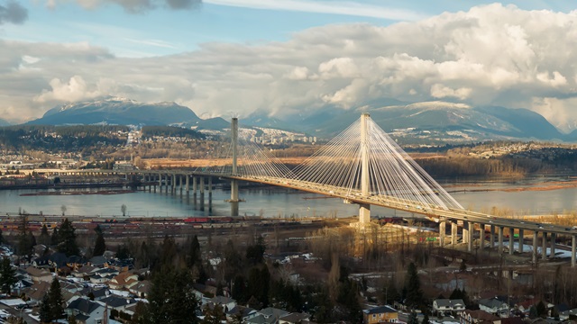 Panoramic view of Port Mann going across Fraser River during a sunny winter day