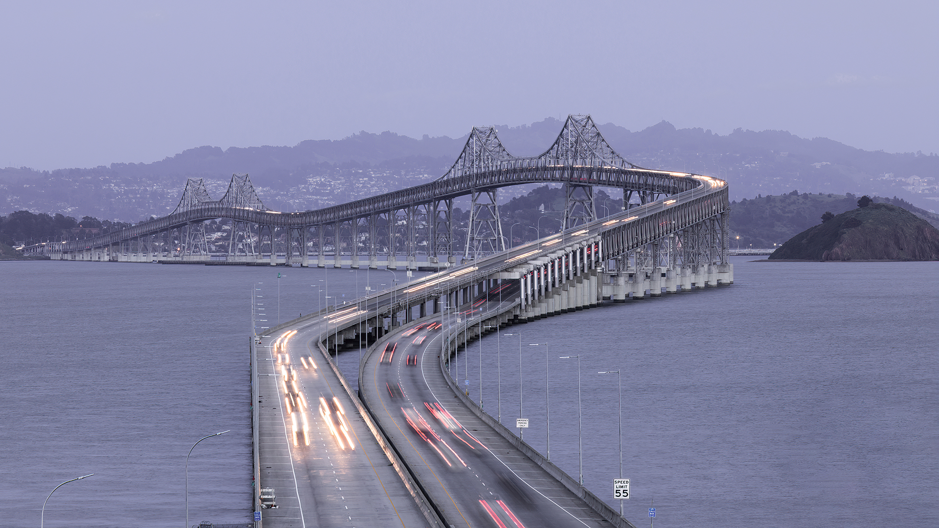 a bridge with cars on it over water