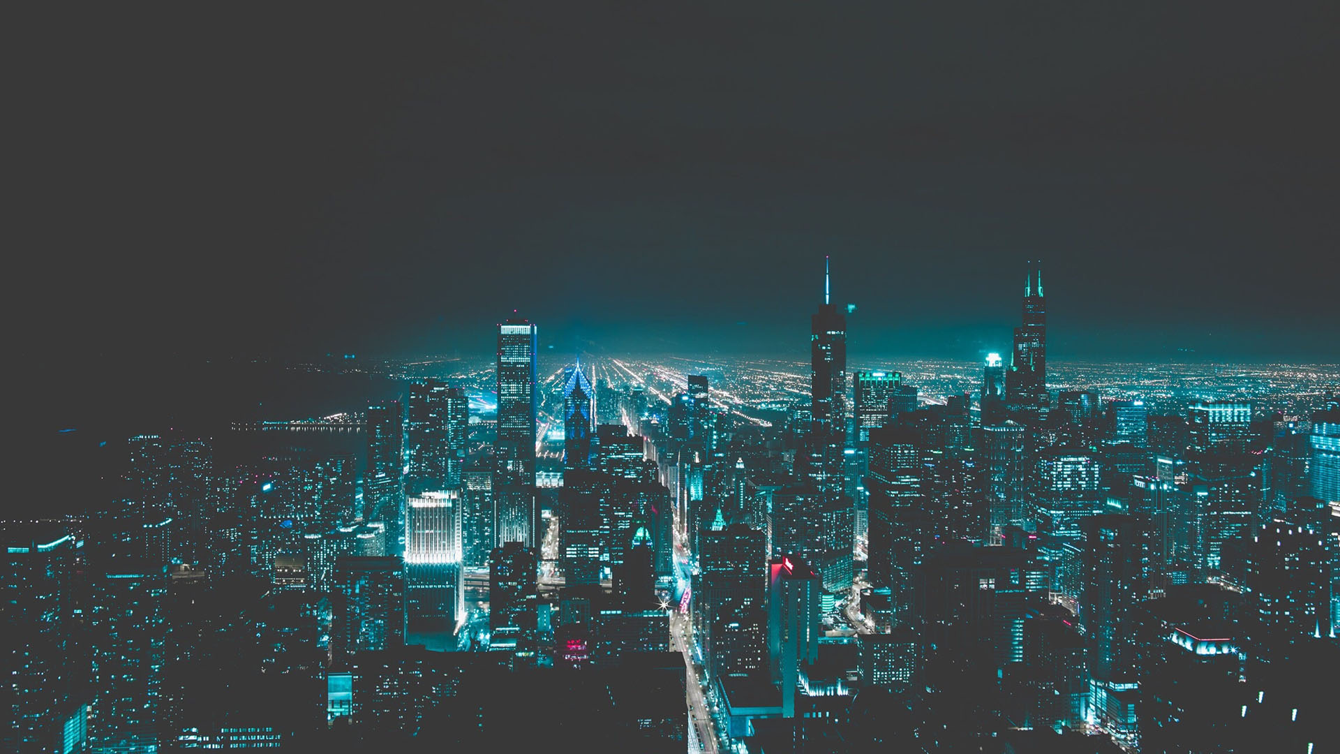 New York City skyline at night with blue-tinted filter