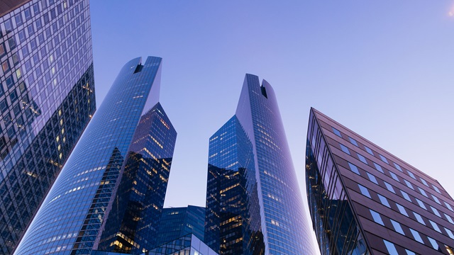 A city's downtown skyline viewed from below