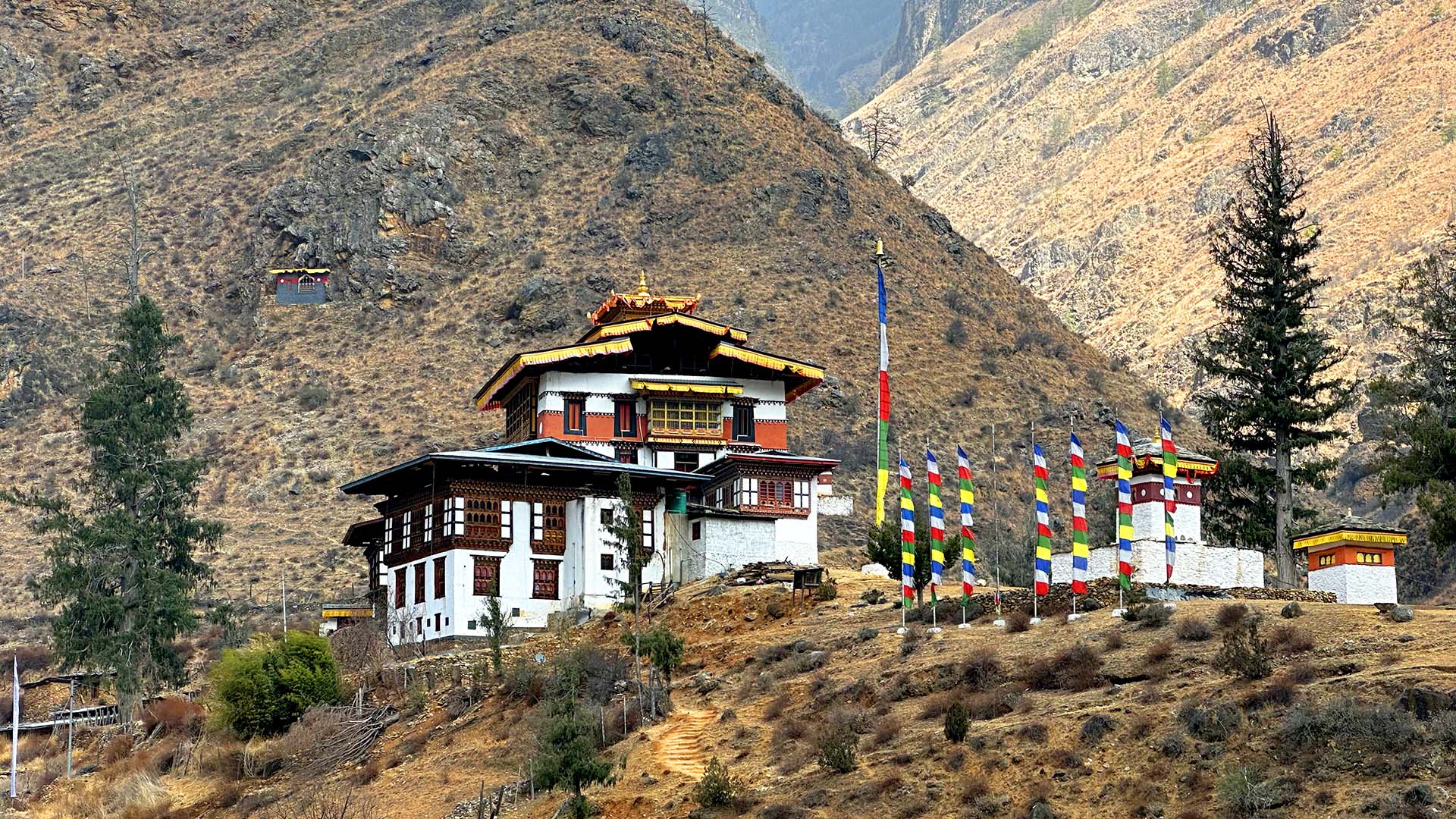 View of a temple-style building within steep mountains