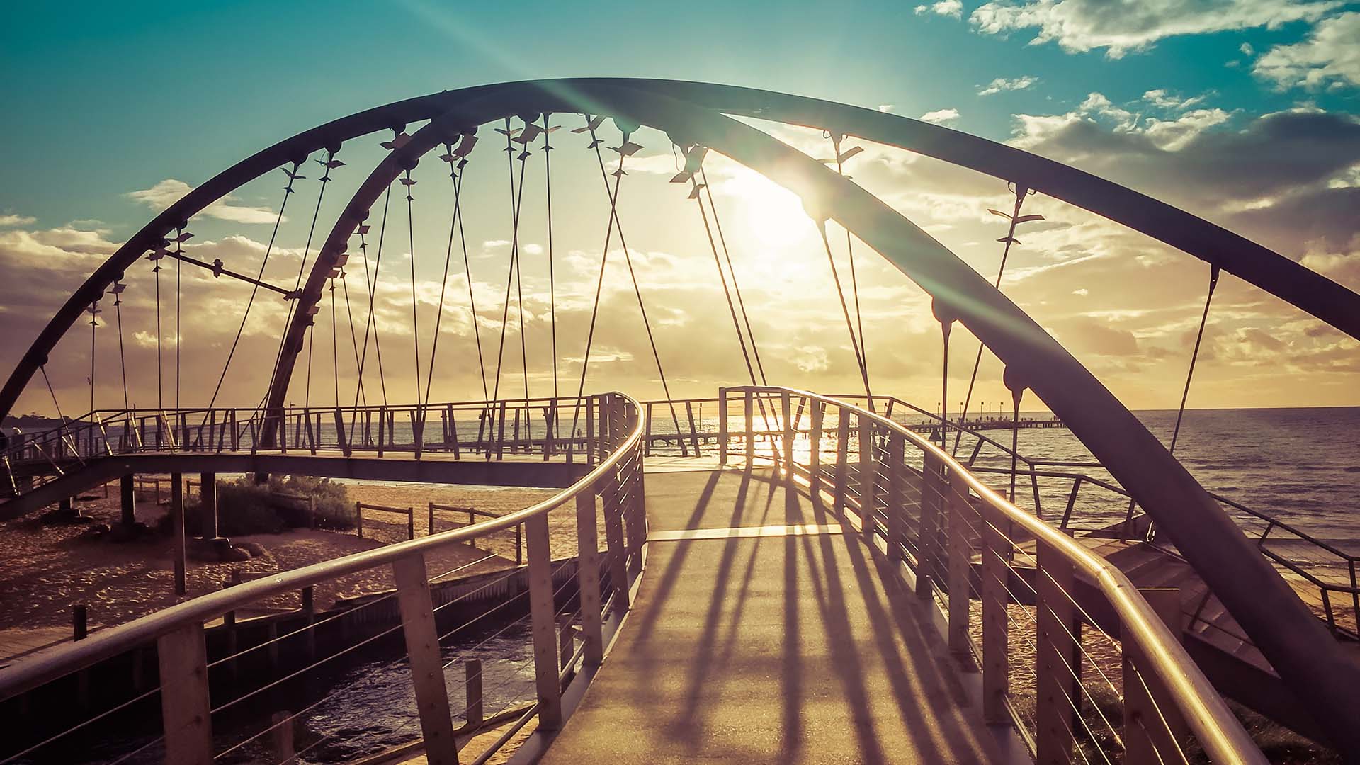 Curved walking bridge in the sunlight