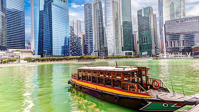 Singapore skyline with boat in water