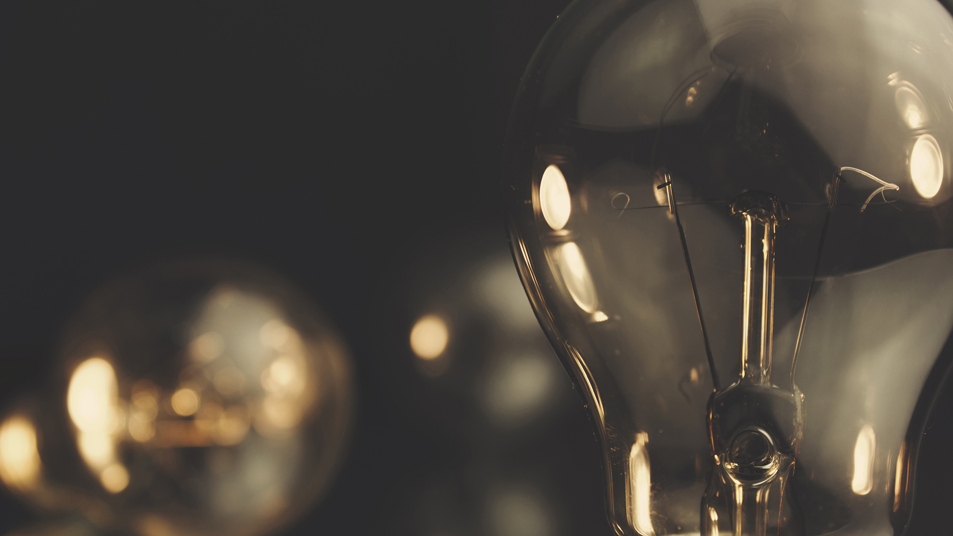 Light bulb with a dark background Light bulb with a dark background
