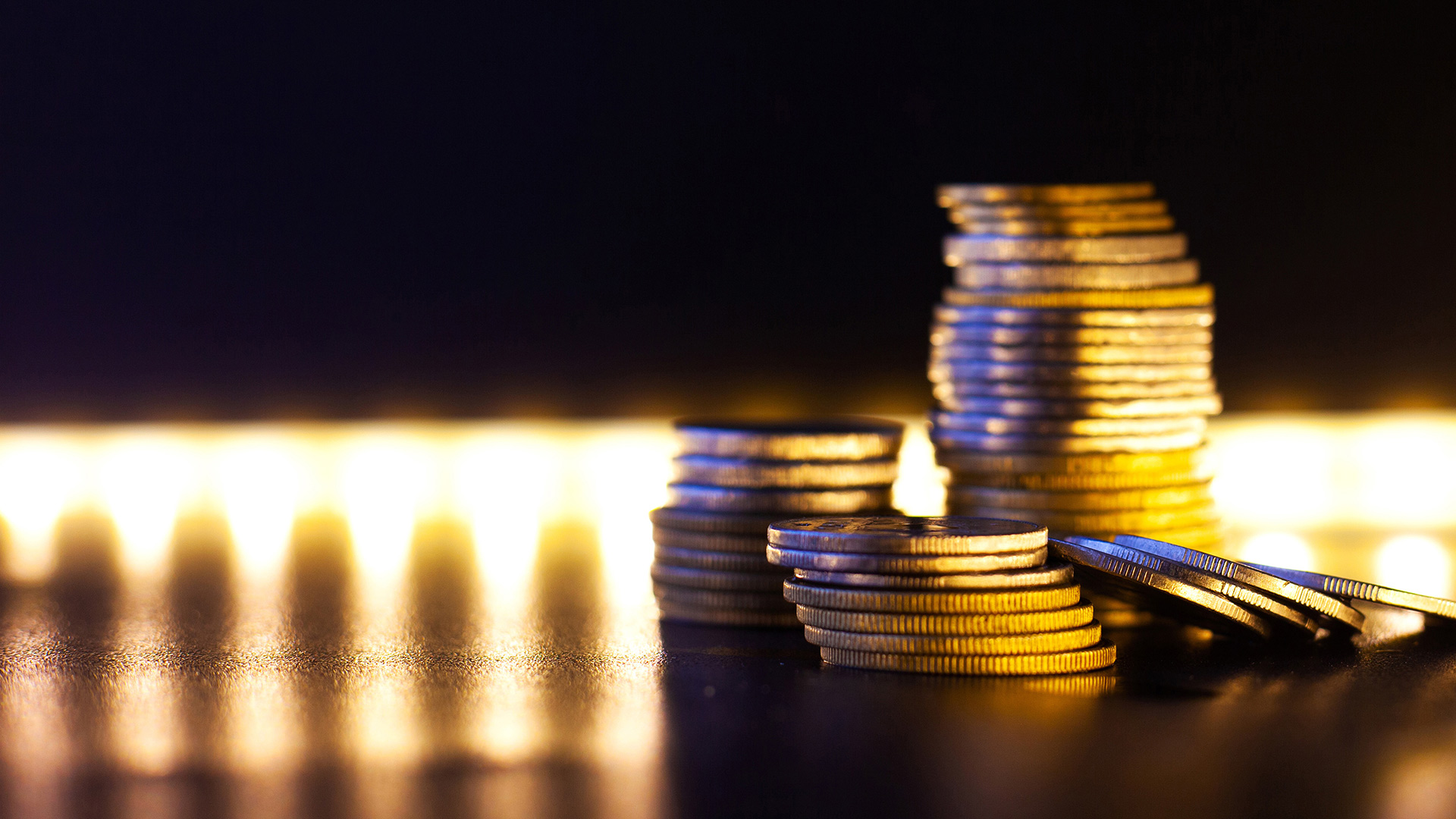 Stacked coins with bright lights