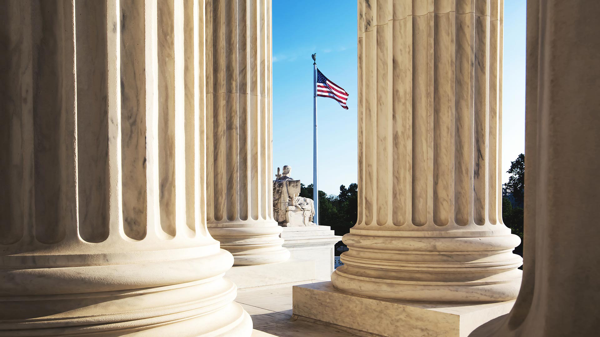 US flag viewed through pillars